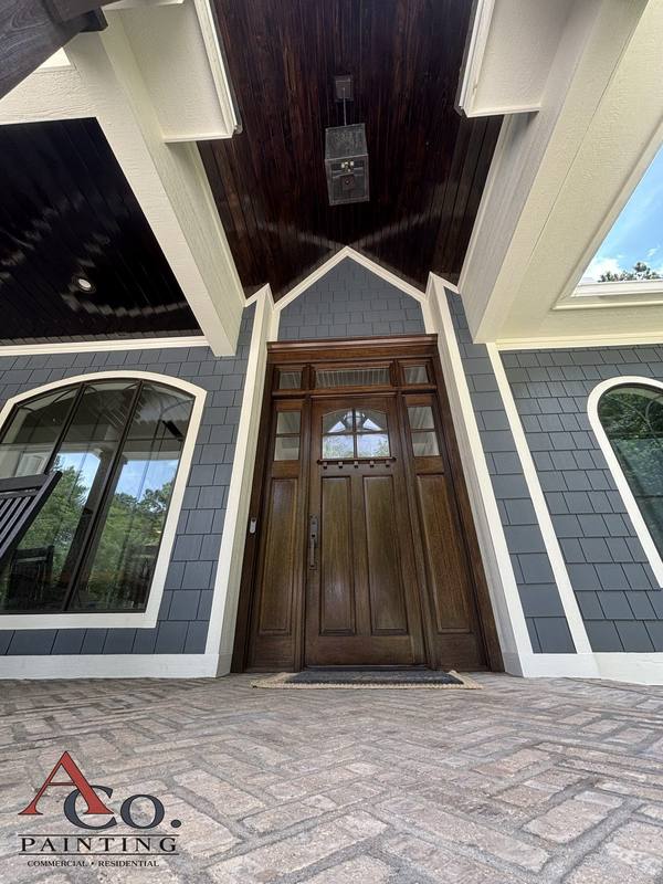 Stained front entry door and porch ceiling detail on a Mississippi home