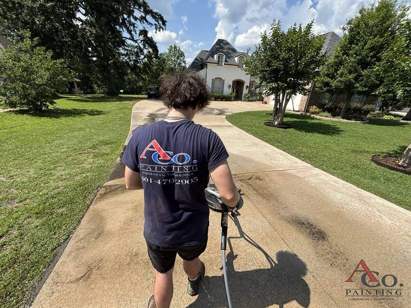 Pressure washing concrete and exterior surfaces in preparation for painting